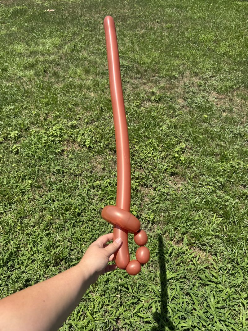 Copper balloon sword for party entertainment in Texas