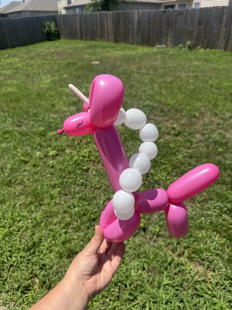 Pink and white balloon unicorn at a kids party in Texas