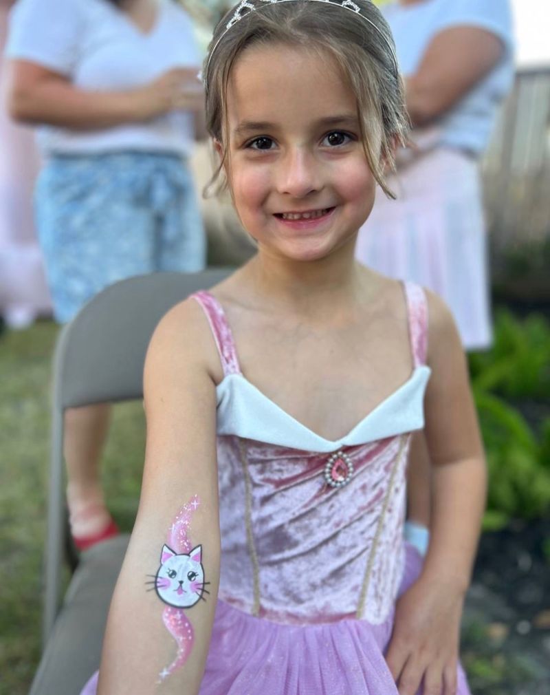 Kitty cat and princess temporary tattoo style art at a Texas birthday party