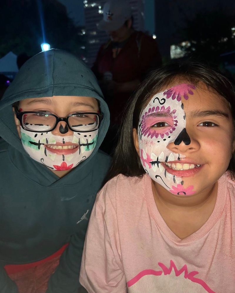 Sugar skull face painting at a kids party event in Texas